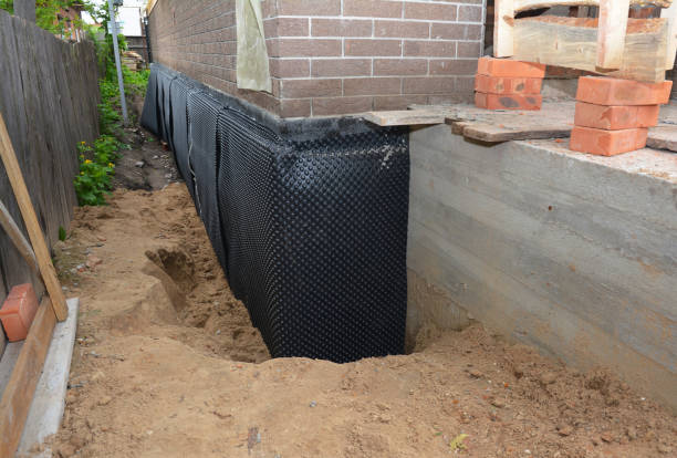 Happy homeowners after waterproofing job in Merrill